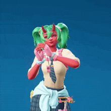 a girl with green hair and horns is wearing a shirt with a badge that says ' ucsd ' on it