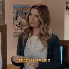 a woman says " nice username " in front of a dog poster