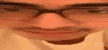 a close up of a man with glasses and a mustache .