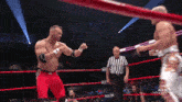 two wrestlers in a ring with the words all in live on the screen