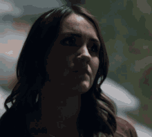 a woman with a serious look on her face