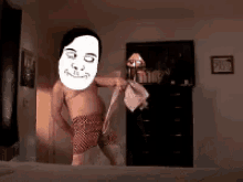 a man with a mask on his face is standing on a bed holding a towel