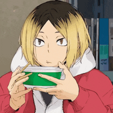 a person holding a green bowl with chopsticks in their hand