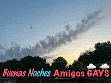 a sign that says buenas noches amigos gays with a cloudy sky in the background