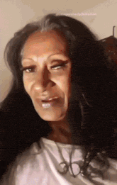 a close up of a woman 's face with the words distinctiveheadgentleman written below her