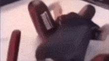 a close up of a person 's hand holding a cell phone .