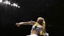 a woman in a wrestling ring with the word stardom on the bottom right