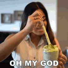 a woman is stirring a drink with a spoon and the words oh my god are above her