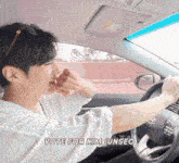 a man driving a car with the words vote for kim junseo written on the bottom