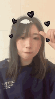 a girl wearing a blue sweatshirt that says yt2at