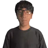 a man wearing glasses and a mathias shirt is smiling