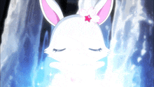 a white rabbit with a pink flower on its ear