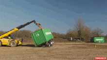 a green container is being lifted by a yellow forklift that says thinkiules on the bottom right