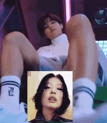a woman wearing fila socks sits next to a man in a white shirt