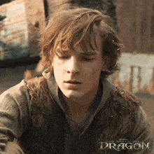 a close up of a man 's face with the words how to train your dragon below him