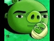 a green angry birds character is holding a baby pig .