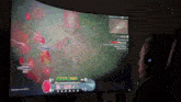 a man wearing headphones playing a video game