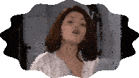 a woman in a white robe with sbt written on the bottom right