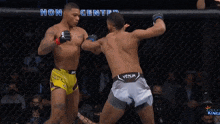 two men are fighting in a cage and the words honda center are behind them
