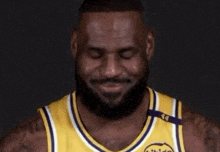 a man with a beard wearing a yellow jersey with the number 46 on it