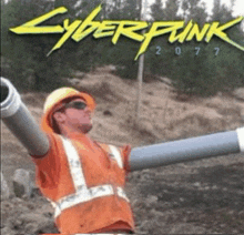 a man in a hard hat and safety vest is holding a pipe in front of a cyberpunk 2077 poster