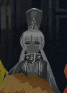 a cartoon character wearing a hat and a hood is sitting on a bed in a dark room .