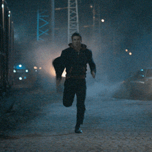 a man running in front of a sign that says ' max '