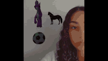 a woman 's face is surrounded by balloons and a horse