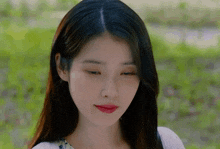 a close up of a woman 's face with a blurred background