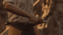 a man in a white shirt is pointing his finger at something