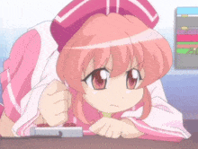 a girl with pink hair and a pink hat is laying on her stomach