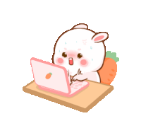 a cartoon rabbit is sitting at a table using a laptop