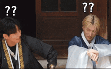 two men are standing next to each other with a question mark above their heads