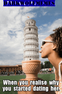 a woman is licking an ice cream cone in front of a very tall building