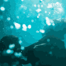 a picture of a person in the water with netflix written on the bottom