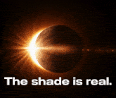 a picture of a partial eclipse with the words " the shade is real " below it