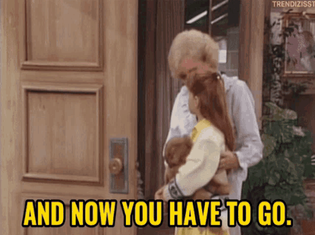 an older woman is holding a little girl in her arms and says 