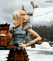 a cartoon character from how to train your dragon is standing in the snow with her hands on her hips .