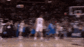 a basketball player wearing a white jersey with the number 18 on it