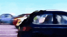 a blurry picture of a parking lot with cars parked in it