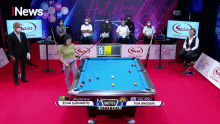 a pool table with a scoreboard that says 26