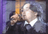 a man singing into a microphone with kbs written on the screen