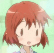 a close up of a cartoon girl with red hair and a surprised look on her face .