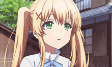 a girl with blonde hair and green eyes has a red x on her hair