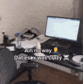 a computer monitor sits on a desk with the words " ain no way dat esex was crazy "