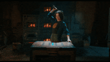 a woman is holding a sword that looks like a gun