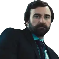 a man in a suit and tie has a lanyard around his neck