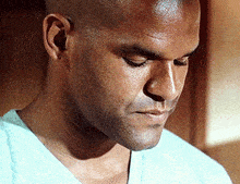 a close up of a man 's face looking down