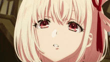 a girl with white hair and red eyes looks at the camera