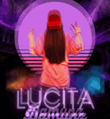 a woman in a pink shirt stands in front of a purple background with lucita written on it